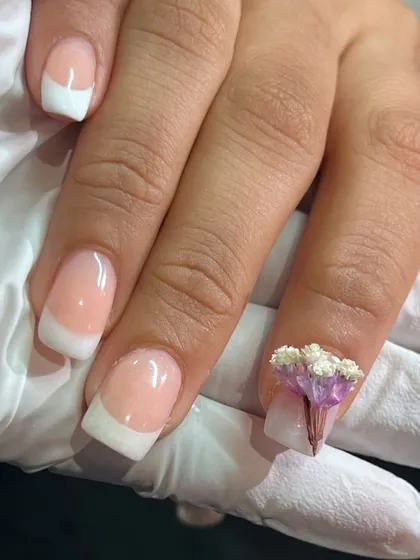 My take on the classic French manicure. I kept the base clean and elegant, then added a tiny, hand-sculpted 3D flower bouquet as an accent. It’s all about adding that one-of-a-kind, personal touch.