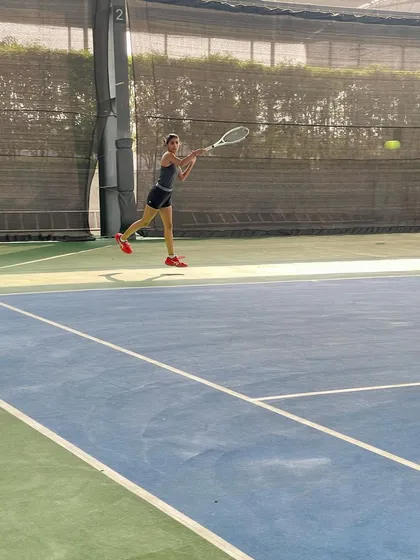 A young athlete perfecting her forehand during a training session on our professional-grade hard courts. We focus on developing strong technical skills and powerful form from an early age.