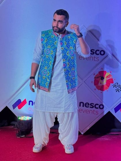 Influencer Viraj Ghelani styling my custom sneakers with a traditional kurta and bandhgala jacket for a Navratri event.
