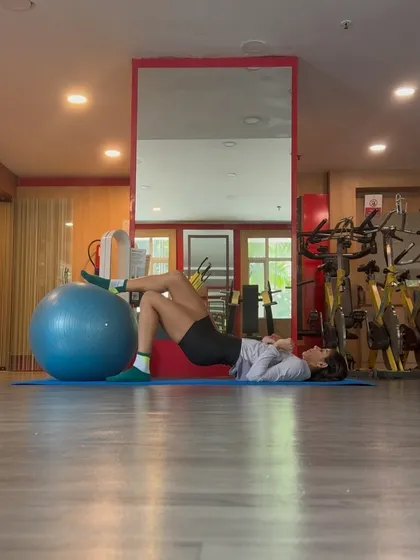 Single leg glute bridges on a stability ball. This advanced variation further challenges your stability and isolates each glute for balanced strength.