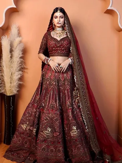 Draped in regal grace, this bride glows in deep red hues. I created bronzy eyes, mauve lips, and glowy cheeks for a luminous and timeless beauty.