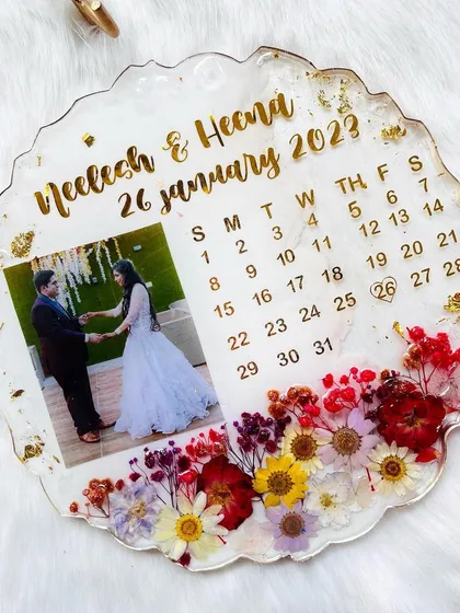 This 10-inch 3D flower frame features a calendar marking the special day. It's a beautiful and creative way to commemorate an anniversary or wedding date.