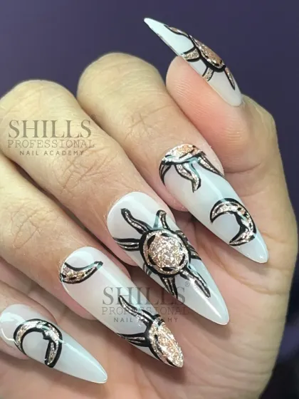 A celestial-themed design with hand-painted sun and moon motifs, accented with rose gold glitter on a pearly white base.