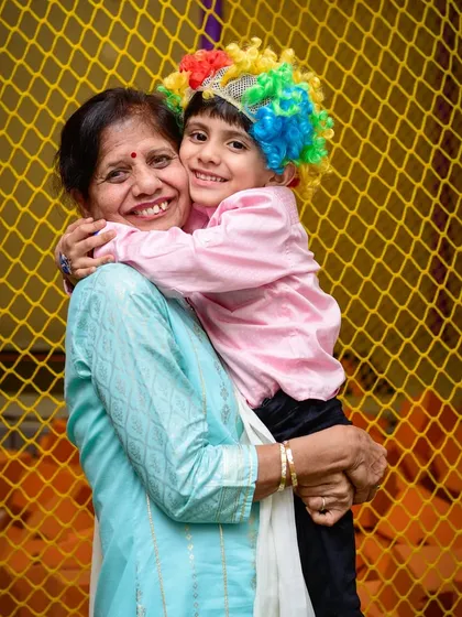 A heartwarming hug between a grandmother and her grandson. Generations of joy!