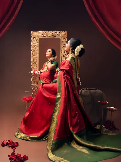 If you dream it, we can create it. This mamma wanted a traditional look, and we brought her vision to life with a beautiful red and green saree, classic jewelry, and an ornate, regal setting.