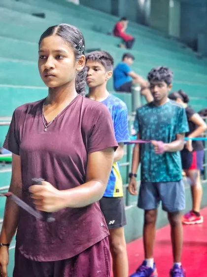 Players line up for a resistance band exercise, focusing on building strength and endurance in a group setting.