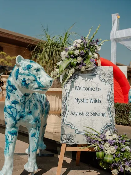 Welcome to the Mystic Wilds. For this carnival, we created an aesthetic dream in blue and white, with custom-painted animal statues and signage that set a unique and artistic tone for the event.