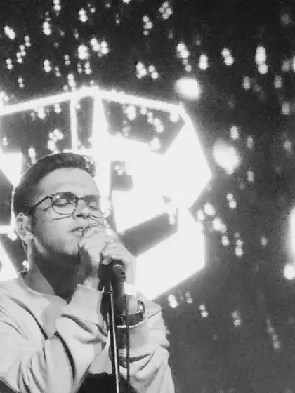 A close up, black and white shot from a Bangalore performance. This captures the emotion and focus that goes into every note I sing.