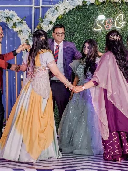 A sweet moment where the whole family joins in a circle on stage. It's all about creating moments of togetherness.