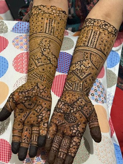 This is a detailed view of my intricate bridal henna work. Each design is unique, combining traditional patterns like paisleys and mandalas with fine-line fillers to create a stunning, full-coverage look for your special day.
