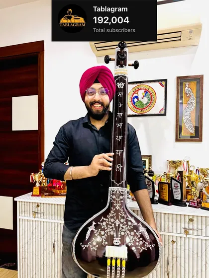 Celebrating 192,000 YouTube subscribers while holding a beautiful Taus, a traditional string instrument. This picture represents my deep connection to both rhythm and melody in Sikh music.