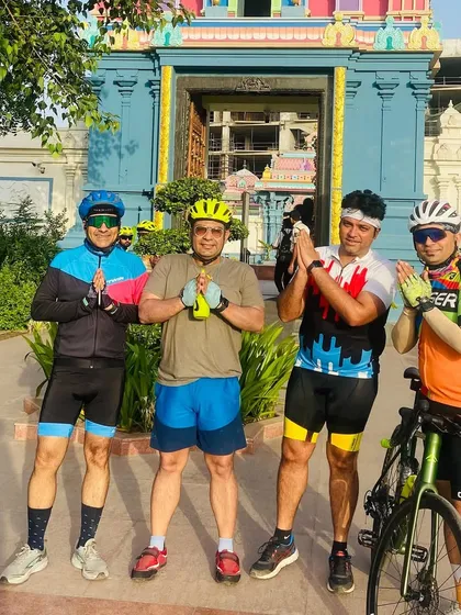 Another shot of the group at the temple. It's a moment of peace and gratitude before we continue our ride.