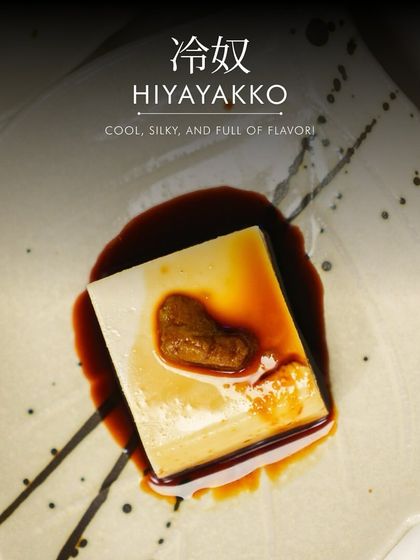 A single serving of Hiyayakko. This dish celebrates the pure, clean flavor of high-quality tofu, enhanced with a simple yet flavorful topping.