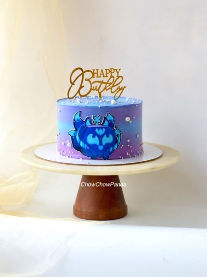 A simple and cute character cake with a purple and blue galaxy-style buttercream finish. This one was a Choco Mousse flavour.
