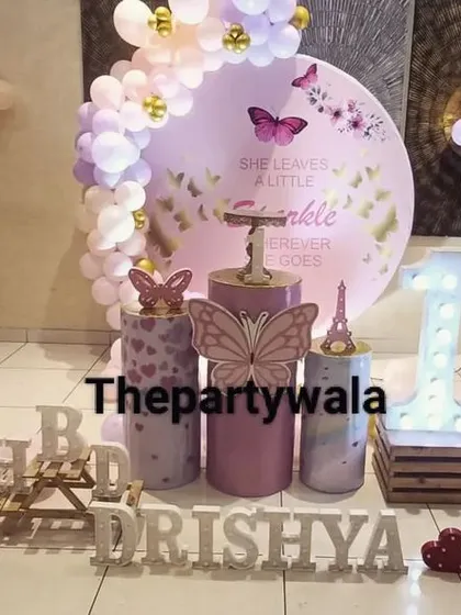 A whimsical fairy theme with multiple fairy cutouts and a beautiful pastel balloon arch. The light-up name sign and "BHD" letters add a personal touch.
