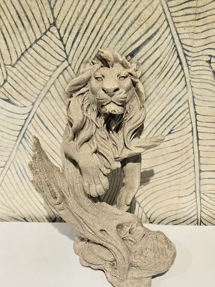 This majestic lion emerging from a branch is another one of my detailed, stone-finished resin showpieces.