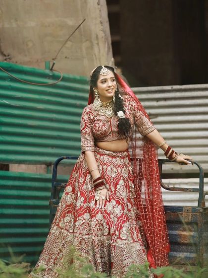 A full view of this beautiful bride. The floral accessory in her braid adds a soft, romantic detail to her look.