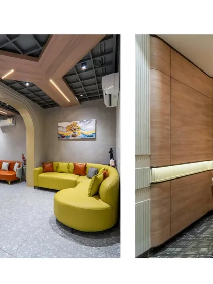 A look at the waiting lounge with its colorful curved sofas and the conference room's unique wooden paneling. The design uses a mix of textures and forms to create visual interest.