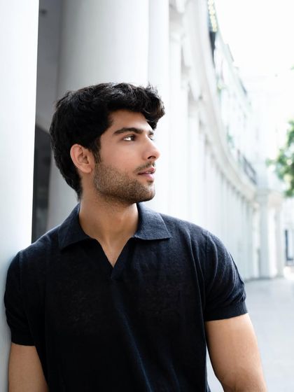 Capturing different angles is key to a versatile portfolio. This shot provides a three-quarter profile, showcasing the model's features against a bright, architectural background, adding depth and variety to the series.