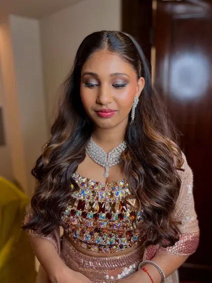 A closer view of the reception makeup, highlighting the blended shimmer eyeshadow and the radiant, dewy finish on the skin.