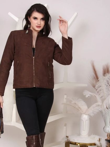 A model wearing a brown zip-up jacket with black pants, showcasing a complete outfit for a winter collection catalog.