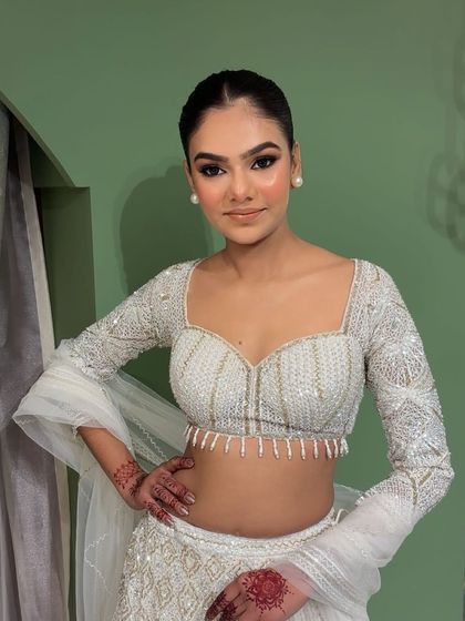 Another angle of this gorgeous soft glam makeup. The pearl earrings and clean lines of the hairstyle add to the overall sophistication.