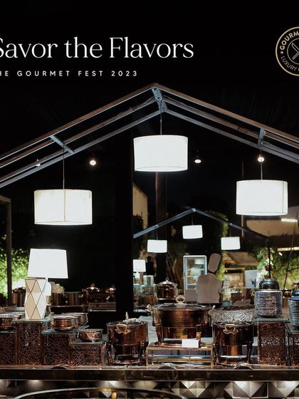 A wide shot of our buffet under modern light fixtures at The Gourmet Fest 2023.