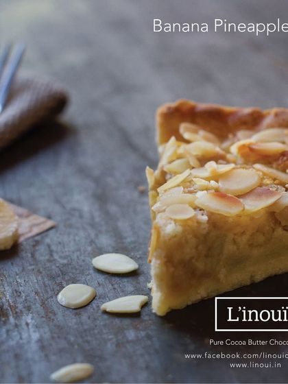 A unique creation from our kitchen, the Banana Pineapple Pie. This experimental pie combines the sweetness of banana and the tang of pineapple in a buttery crust, topped with toasted almonds.