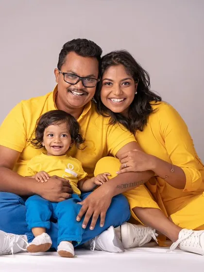 A family dressed in sunshine yellow. This coordinated outfit choice adds a bright and cheerful feel to their beautiful family portrait.