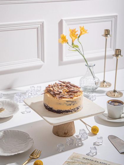 A beautifully styled shot of our Mango and Chocolate ice cream cake, perfect for an afternoon dessert session.