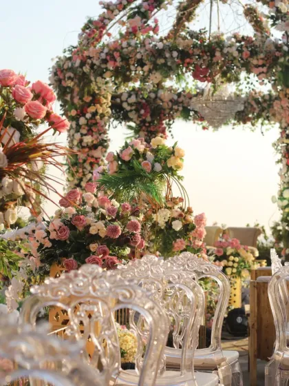 The intricate floral decor at a destination wedding. These beautiful details often find their way into our paintings.