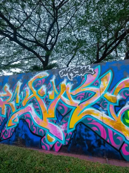 The finished Masala style piece in Jakarta. The vibrant pinks and yellows against the dark blue background make the Devnagri letters really stand out.