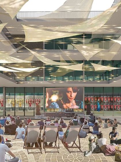The central courtyard of the Museum Block, envisioned as a flexible community space for events like outdoor film screenings. The canopy of fabric sails provides shade, turning the courtyard into a comfortable gathering spot that connects the museum, cafe, and other functions.