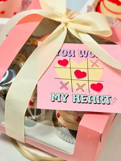My "You Won My Heart" cupcake box is a playful and sweet Valentine's gift. The cute tic-tac-toe card adds a fun touch to the delicious, freshly baked cupcakes inside.