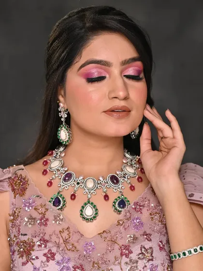 Another close-up view of the intricate eye makeup. The combination of pinks and purples creates a beautiful contrast, perfect for a beauty-focused editorial.