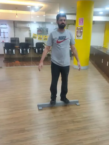 Our training methods are designed for shooters of all ages. An adult learner is seen here working on his balance and posture, an essential part of our basic course curriculum to ensure a solid foundation.