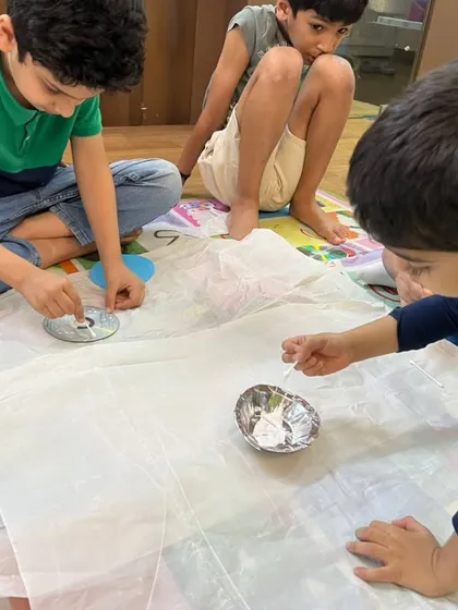 Deep in concentration during a camp activity. We provide a variety of engaging projects to keep kids curious and focused.
