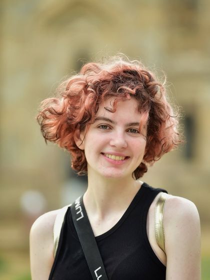 A classic headshot with a beautiful, friendly smile. This is a perfect example of a clean and professional portrait, great for any profile.