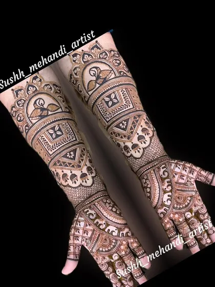 A striking full-arm design with peacocks and geometric patterns. The angled placement of the photo shows how the design looks from a different perspective.