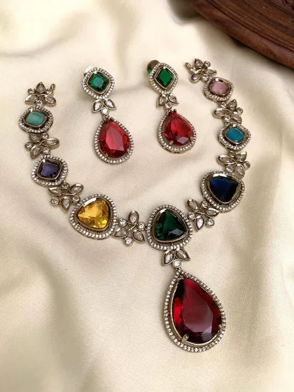 For those who love a splash of color, this Navratan-inspired necklace set features nine different colored stones. It's a vibrant and versatile piece, perfect for festive occasions, bringing together traditional concepts with a modern design sensibility.