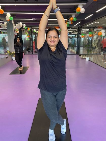 This participant holds a beautiful Eagle Pose with arms extended, showing strength and flexibility.