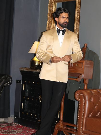 A relaxed yet poised stance in our classic ivory tuxedo.