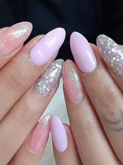 A pretty pastel set with lavender and pink glitter nails.