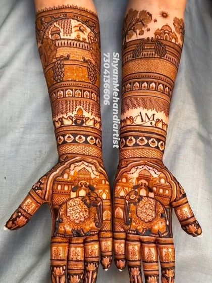 A beautiful design featuring personalized initials "AM" and scenic elements like trees and peacocks.