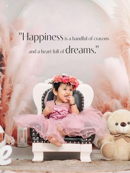A princess in her castle. This bohemian-themed studio setup with pampas grass, a mini throne, and a teddy bear creates a magical setting for a first birthday portrait.