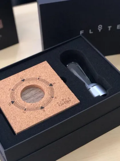 Inside the FLYTE box, each component is securely nestled. The package includes the wooden base, the bulb, and a cork mat to assist with setup, ensuring a premium experience from the start.