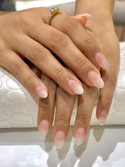 Another beautiful example of our ombré nail extensions. The gradual fade is expertly blended for a natural and elegant finish.