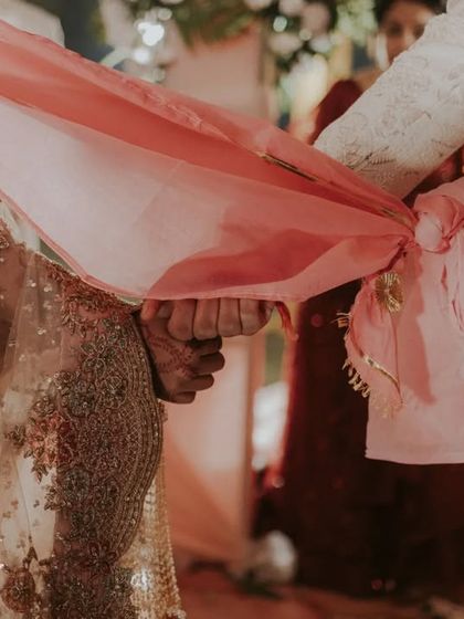 A close up of the gathbandhan, the tying of the knot, which symbolically joins the bride and groom for life.