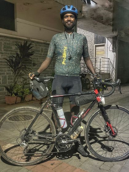 A finisher of the Jog Falls 1000K BRM, exhausted but proud. This image captures the raw emotion of completing a 1000km ultra-endurance event.