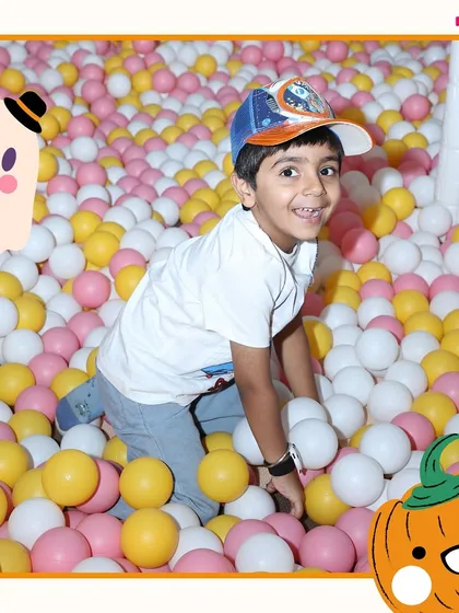 A big smile from inside the ball pit. It's one of the most popular spots in our play cafe for a reason.
